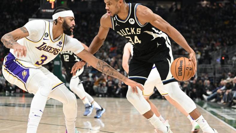 Dec 2, 2022; Milwaukee, Wisconsin, USA; Milwaukee Bucks forward Giannis Antetokounmpo (34) drives against Los Angeles Lakers forward Anthony Davis (3) in the first half at Fiserv Forum. Mandatory Credit: Michael McLoone-USA TODAY Sports