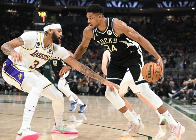 Dec 2, 2022; Milwaukee, Wisconsin, USA; Milwaukee Bucks forward Giannis Antetokounmpo (34) drives against Los Angeles Lakers forward Anthony Davis (3) in the first half at Fiserv Forum. Mandatory Credit: Michael McLoone-USA TODAY Sports