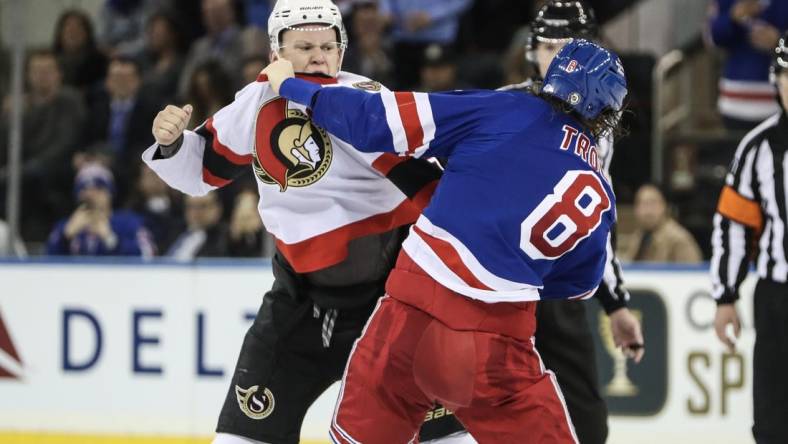 Dec 2, 2022; New York, New York, USA;  Ottawa Senators left wing Brady Tkachuk (7) fights with New York Rangers defenseman Jacob Trouba (8) in the second period at Madison Square Garden. Mandatory Credit: Wendell Cruz-USA TODAY Sports