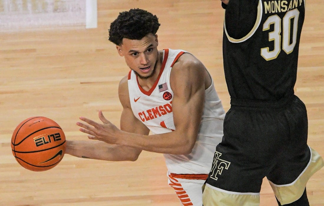 Dec 2, 2022; Clemson, SC, USA;  Clemson junior guard Chase Hunter (1) passes around Wake Forest guard Damari Monsanto (30) during the second half at Littlejohn Coliseum Friday, December 2, 2022. Mandatory Credit: Ken Ruinard/USA TODAY-USA TODAY NETWORK