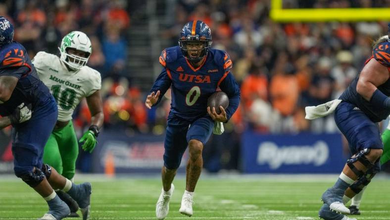 Dec 2, 2022; San Antonio, Texas, USA;  UTSA Roadrunners quarterback Frank Harris (0) runs the ball in the first half against the North Texas Mean Green at the Alamodome. Mandatory Credit: Daniel Dunn-USA TODAY Sports