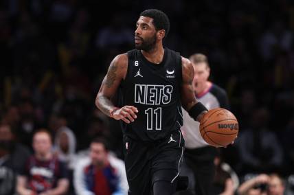Dec 2, 2022; Brooklyn, New York, USA; Brooklyn Nets guard Kyrie Irving (11) dribbles up court during the second half against the Toronto Raptors at Barclays Center. Mandatory Credit: Vincent Carchietta-USA TODAY Sports