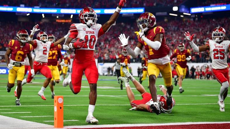 Dec 2, 2022; Las Vegas, NV, USA; Utah Utes wide receiver Money Parks (10) runs the ball for a touchdown against the Southern California Trojans during the second half of the PAC-12 Football Championship at Allegiant Stadium. Mandatory Credit: Gary A. Vasquez-USA TODAY Sports