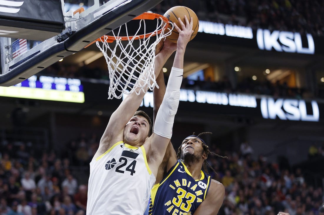 Dec 2, 2022; Salt Lake City, Utah, USA;  Utah Jazz center Walker Kessler (24) and Indiana Pacers center Myles Turner (33) battle in the second half at Vivint Arena. Mandatory Credit: Jeffrey Swinger-USA TODAY Sports