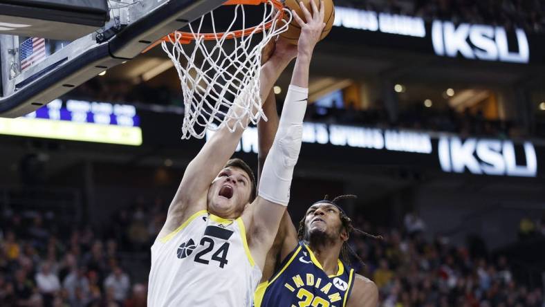 Dec 2, 2022; Salt Lake City, Utah, USA;  Utah Jazz center Walker Kessler (24) and Indiana Pacers center Myles Turner (33) battle in the second half at Vivint Arena. Mandatory Credit: Jeffrey Swinger-USA TODAY Sports