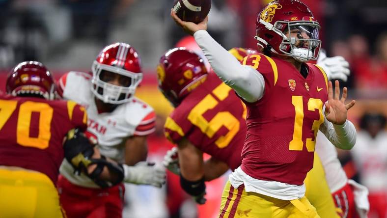 Dec 2, 2022; Las Vegas, NV, USA; Southern California Trojans quarterback Caleb Williams (13) throws against the Utah Utes during the second half in the PAC-12 Football Championship at Allegiant Stadium. Mandatory Credit: Gary A. Vasquez-USA TODAY Sports