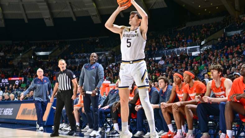 Dec 3, 2022; South Bend, Indiana, USA; Notre Dame Fighting Irish guard Cormac Ryan (5) shoots a three point basket in the first half against the Syracuse Orange at the Purcell Pavilion. Mandatory Credit: Matt Cashore-USA TODAY Sports