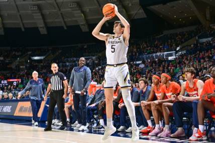 Dec 3, 2022; South Bend, Indiana, USA; Notre Dame Fighting Irish guard Cormac Ryan (5) shoots a three point basket in the first half against the Syracuse Orange at the Purcell Pavilion. Mandatory Credit: Matt Cashore-USA TODAY Sports