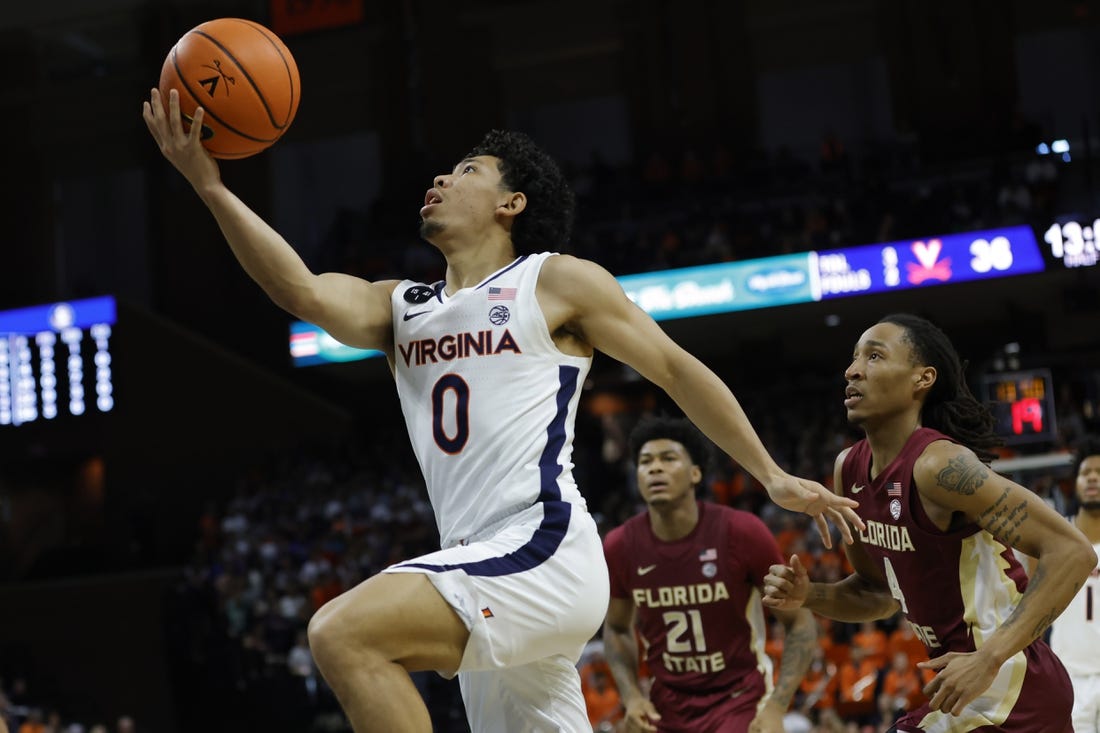 Dec 3, 2022; Charlottesville, Virginia, USA; Virginia Cavaliers guard Kihei Clark (0) shoots the ball as Florida State Seminoles guard Caleb Mills (4) looks on in the second half at John Paul Jones Arena. Mandatory Credit: Geoff Burke-USA TODAY Sports