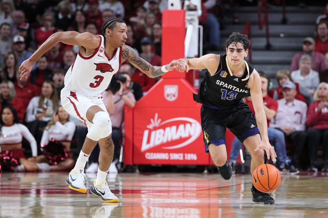 Dec 3, 2022; Fayetteville, Arkansas, USA; San Jose State Spartans guard Alvaro Cardenas (13) drives against  Arkansas Razorbacks guard Nick Smith Jr (3) during the first half at Bud Walton Arena. Mandatory Credit: Nelson Chenault-USA TODAY Sports