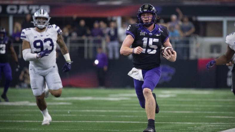 Dec 3, 2022; Arlington, TX, USA; TCU Horned Frogs quarterback Max Duggan (15) runs down the sidelines for a first down against the Kansas State Wildcats during the second half at AT&T Stadium. Mandatory Credit: Jerome Miron-USA TODAY Sports