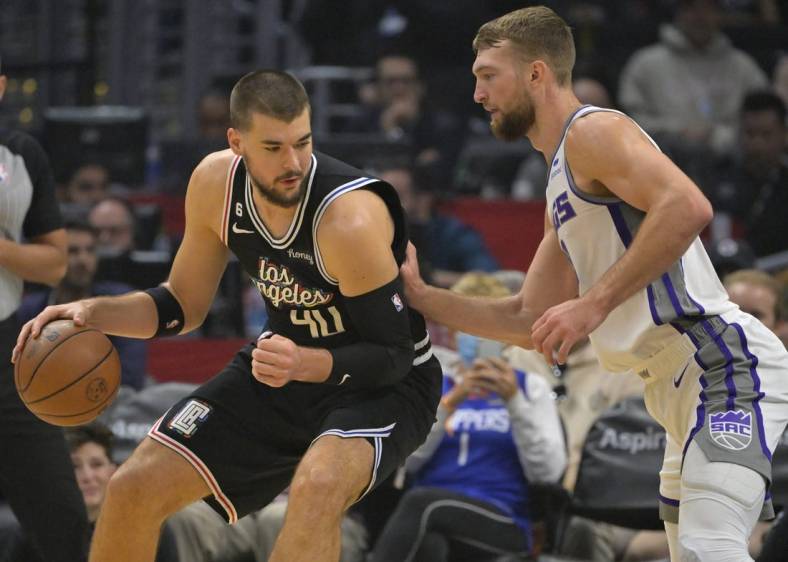 Dec 3, 2022; Los Angeles, California, USA;  Los Angeles Clippers center Ivica Zubac (40) is defended by Sacramento Kings forward Domantas Sabonis (10) in the first half at Crypto.com Arena. Mandatory Credit: Jayne Kamin-Oncea-USA TODAY Sports