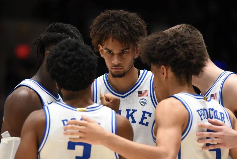 Dec 3, 2022; Durham, North Carolina, USA; Duke Blue Devils center Dereck Lively (center) and other starters huddle prior to a game against the Boston College Eagles at Cameron Indoor Stadium. Mandatory Credit: Rob Kinnan-USA TODAY Sports
