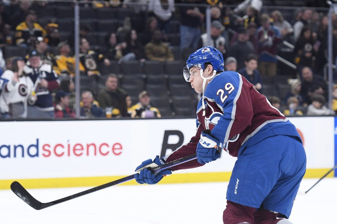 Dec 3, 2022; Boston, Massachusetts, USA; Colorado Avalanche center Nathan MacKinnon (29) shoots the puck during warmups prior to a game against the Boston Bruins at TD Garden. Mandatory Credit: Bob DeChiara-USA TODAY Sports