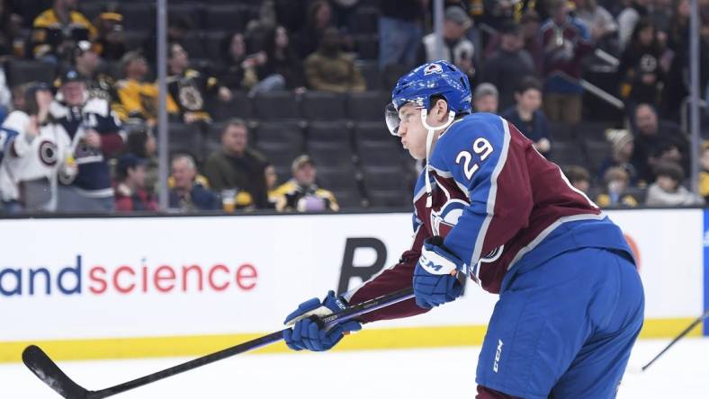 Dec 3, 2022; Boston, Massachusetts, USA; Colorado Avalanche center Nathan MacKinnon (29) shoots the puck during warmups prior to a game against the Boston Bruins at TD Garden. Mandatory Credit: Bob DeChiara-USA TODAY Sports