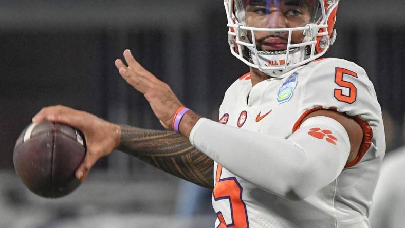 Dec 3, 2022; Charlotte, NC, USA; Clemson Tigers quarterback DJ Uiagalelei (5) warms up before the ACC Championship game against the North Carolina Tarheels at Bank of America Stadium. Mandatory Credit: Ken Ruinard-USA TODAY NETWORK