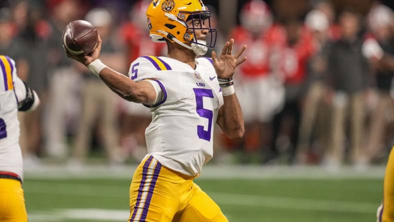 Dec 3, 2022; Atlanta, GA, USA; LSU Tigers quarterback Jayden Daniels (5) passes the ball against the Georgia Bulldogs at Mercedes-Benz Stadium. Mandatory Credit: Dale Zanine-USA TODAY Sports