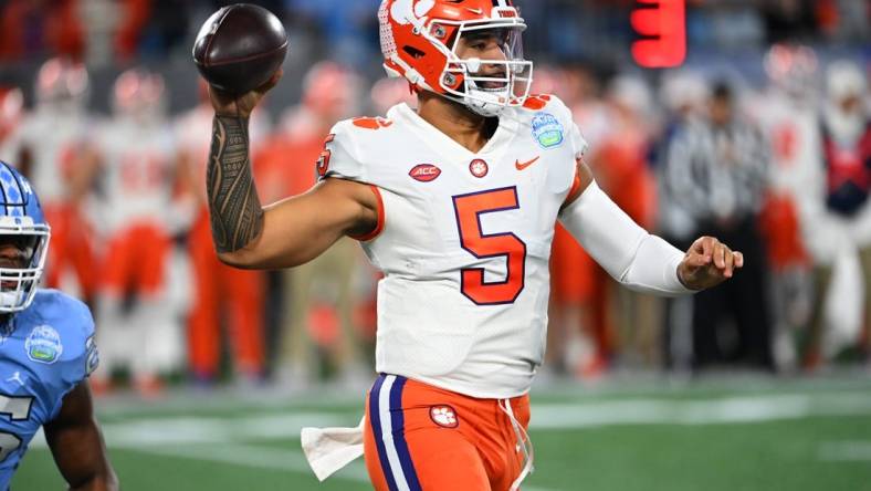 Dec 3, 2022; Charlotte, North Carolina, USA; Clemson Tigers quarterback DJ Uiagalelei (5)throws during the first quarter of the ACC Championship game against the North Carolina Tar Heels at Bank of America Stadium. Mandatory Credit: Bob Donnan-USA TODAY Sports