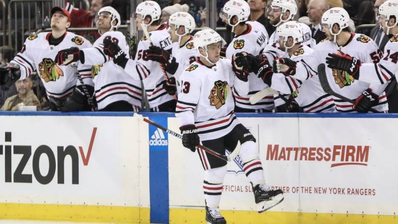 Dec 3, 2022; New York, New York, USA;  Chicago Blackhawks center Max Domi (13) celebrates with his teammates after scoring in the second period against the New York Rangers at Madison Square Garden. Mandatory Credit: Wendell Cruz-USA TODAY Sports