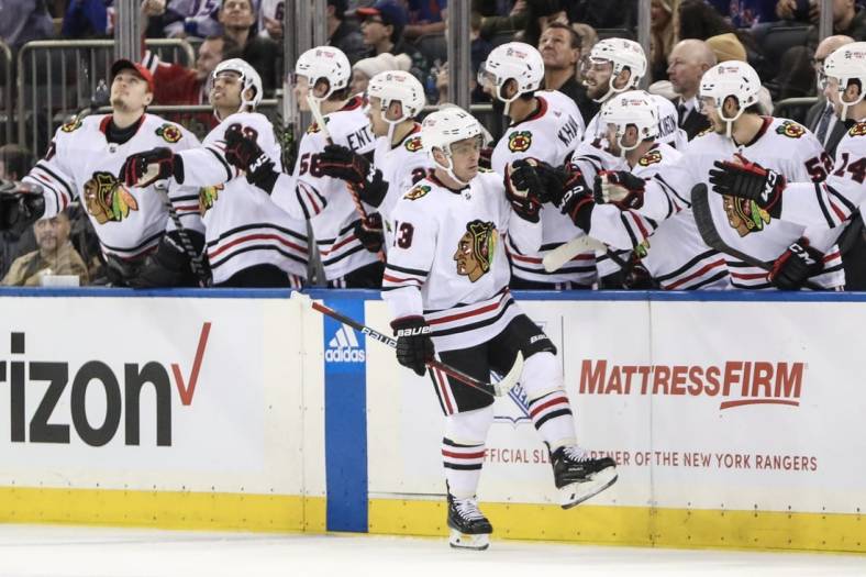 Dec 3, 2022; New York, New York, USA;  Chicago Blackhawks center Max Domi (13) celebrates with his teammates after scoring in the second period against the New York Rangers at Madison Square Garden. Mandatory Credit: Wendell Cruz-USA TODAY Sports