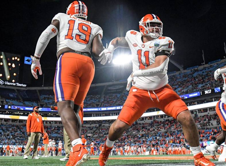 Dec 3, 2022; Charlotte, NC, USA; Clemson Tigers defensive lineman Bryan Bresee (11) warms up with defensive lineman DeMonte Capehart (19)  before the ACC Championship game against the North Carolina Tar Heels at Bank of America Stadium. Mandatory Credit: Ken Ruinard-USA TODAY NETWORK