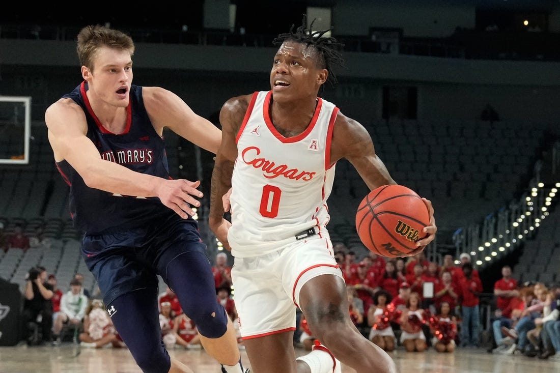 Dec 3, 2022; Fort Worth, Texas, USA;  Houston Cougars guard Marcus Sasser (0) drives to the basket past St. Mary's Gaels center Mitchell Saxen (11) during the first half at Dickies Arena. Mandatory Credit: Chris Jones-USA TODAY Sports