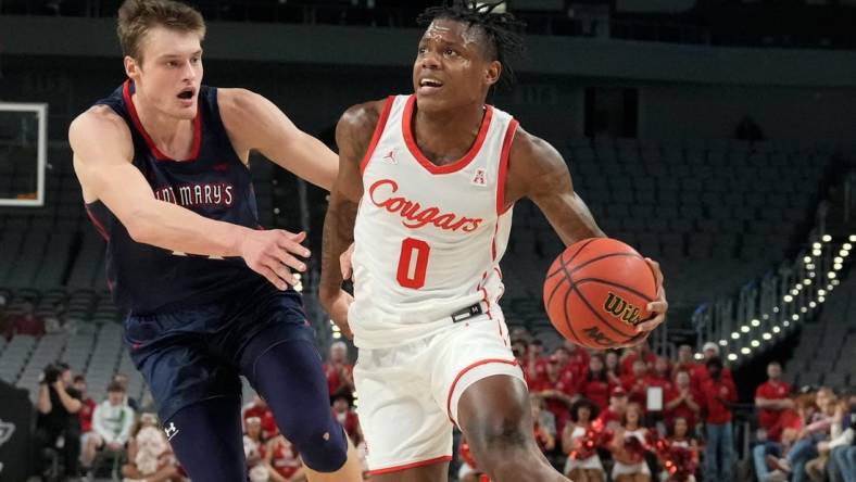 Dec 3, 2022; Fort Worth, Texas, USA;  Houston Cougars guard Marcus Sasser (0) drives to the basket past St. Mary's Gaels center Mitchell Saxen (11) during the first half at Dickies Arena. Mandatory Credit: Chris Jones-USA TODAY Sports