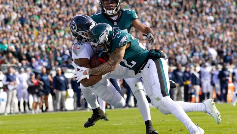 Dec 4, 2022; Philadelphia, Pennsylvania, USA;  Tennessee Titans wide receiver Treylon Burks (16) is hit by Philadelphia Eagles safety Marcus Epps (22) as he makes a touchdown catch during the first quarter at Lincoln Financial Field. Mandatory Credit: Bill Streicher-USA TODAY Sports