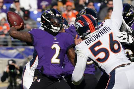 Dec 4, 2022; Baltimore, Maryland, USA; Baltimore Ravens quarterback Tyler Huntley (2) pressured in the second quarter by Denver Broncos linebacker Baron Browning (56) at M&T Bank Stadium. Mandatory Credit: Mitch Stringer-USA TODAY Sports