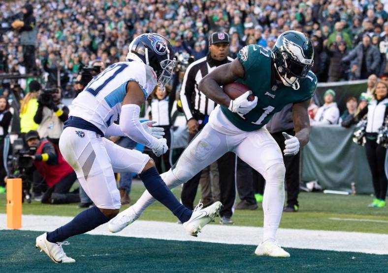 Dec 4, 2022; Philadelphia, Pennsylvania, USA;  Philadelphia Eagles wide receiver A.J. Brown (11) makes a touchdown catch past Tennessee Titans cornerback Tre Avery (30) during the third quarter at Lincoln Financial Field. Mandatory Credit: Bill Streicher-USA TODAY Sports