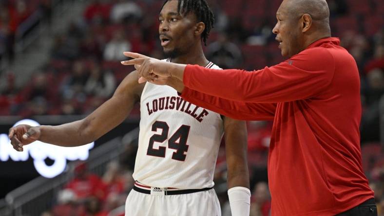 Dec 4, 2022; Louisville, Kentucky, USA;  Louisville Cardinals head coach Kenny Payne talks with forward Jae'Lyn Withers (24) during the second half against the Miami (Fl) Hurricanes at KFC Yum! Center. Miami defeated Louisville 80-53. Mandatory Credit: Jamie Rhodes-USA TODAY Sports