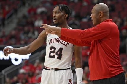 Dec 4, 2022; Louisville, Kentucky, USA;  Louisville Cardinals head coach Kenny Payne talks with forward Jae'Lyn Withers (24) during the second half against the Miami (Fl) Hurricanes at KFC Yum! Center. Miami defeated Louisville 80-53. Mandatory Credit: Jamie Rhodes-USA TODAY Sports