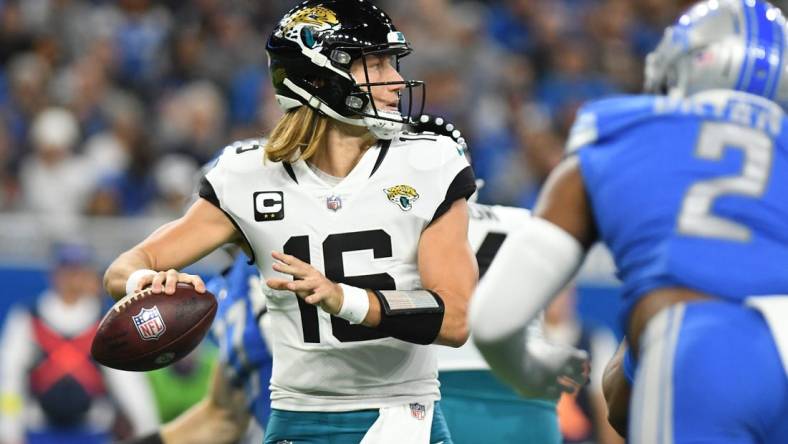 Dec 4, 2022; Detroit, Michigan, USA; Jacksonville Jaguars quarterback Trevor Lawrence (16) throws a pass against the Detroit Lions in the second quarter at Ford Field. Mandatory Credit: Lon Horwedel-USA TODAY Sports