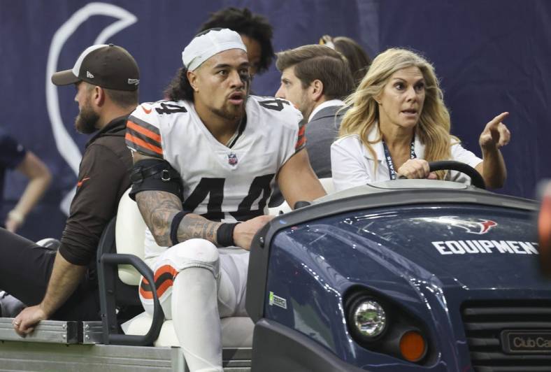 Dec 4, 2022; Houston, Texas, USA; Cleveland Browns linebacker Sione Takitaki (44) leaves the game on a cart during the fourth quarter against the Houston Texans at NRG Stadium. Mandatory Credit: Troy Taormina-USA TODAY Sports