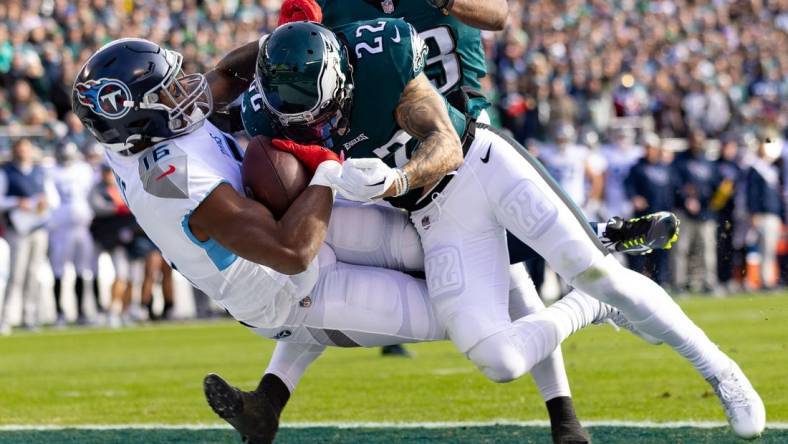 Dec 4, 2022; Philadelphia, Pennsylvania, USA;  Tennessee Titans wide receiver Treylon Burks (16) is hit by Philadelphia Eagles safety Marcus Epps (22) as he makes a touchdown catch during the first quarter at Lincoln Financial Field. Mandatory Credit: Bill Streicher-USA TODAY Sports