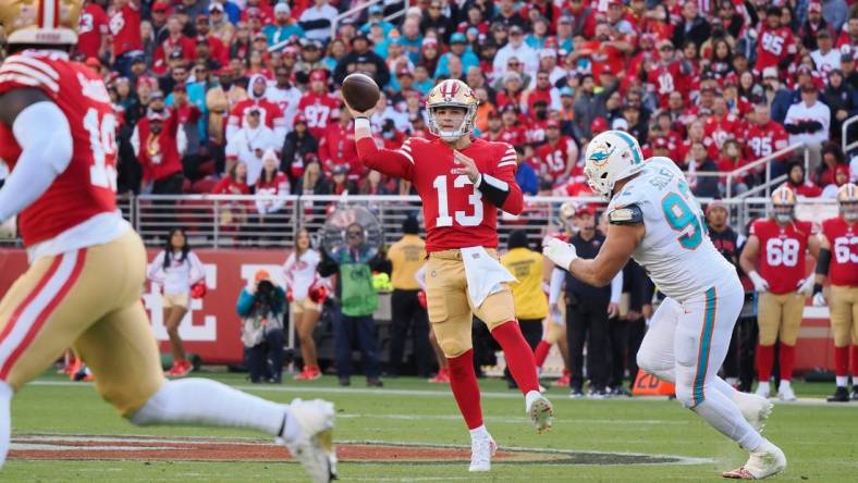Dec 4, 2022; Santa Clara, California, USA; San Francisco 49ers quarterback Brock Purdy (13) throws the ball against Miami Dolphins defensive end Zach Sieler (92) during the first quarter at Levi's Stadium. Mandatory Credit: Kelley L Cox-USA TODAY Sports