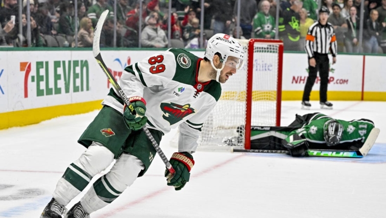 December 4, 2022;  Dallas, Texas, United States;  Minnesota Wild center Frederick Gaudreau (89) scores the winning goal against Dallas Stars goaltender Scott Wedgewood (41) during the overtime shootout period at the American Airlines Center.  Mandatory Credit: Jerome Miron-USA TODAY Sports