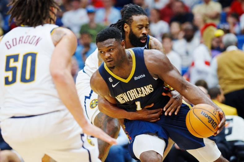 Dec 4, 2022; New Orleans, Louisiana, USA; New Orleans Pelicans forward Zion Williamson (1) is fouled by Denver Nuggets center DeAndre Jordan (6) during the fourth quarter at Smoothie King Center. Mandatory Credit: Andrew Wevers-USA TODAY Sports