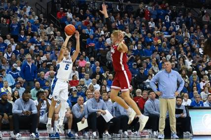 Dec 4, 2022; Omaha, Nebraska, USA;  Creighton Bluejays guard Francisco Farabello (5) scores on a three point shot over Nebraska Cornhuskers guard Sam Griesel (5) in the second half at CHI Health Center Omaha. Mandatory Credit: Steven Branscombe-USA TODAY Sports