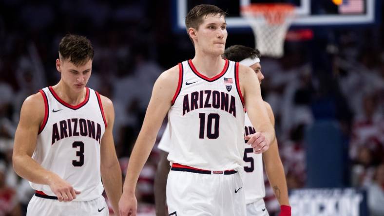 Dec 4, 2022; Tucson, Arizona, USA; Arizona Wildcats forward Azuolas Tubelis (10), guard Pelle Larsson (3), and  guard Kerr Kriisa (25) walk back to the bench during the second half against the Cal Golden Bears at McKale Center. Mandatory Credit: Zachary BonDurant-USA TODAY Sports