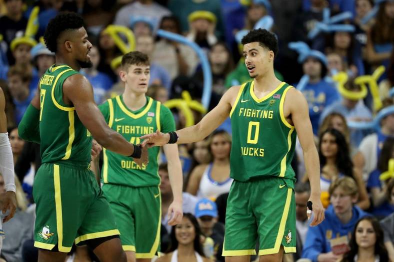 Dec 4, 2022; Los Angeles, California, USA; Oregon Ducks guard Will Richardson (0) greets forward Quincy Guerrier (13) during the second half against the UCLA Bruins at Pauley Pavilion presented by Wescom. Mandatory Credit: Kiyoshi Mio-USA TODAY Sports