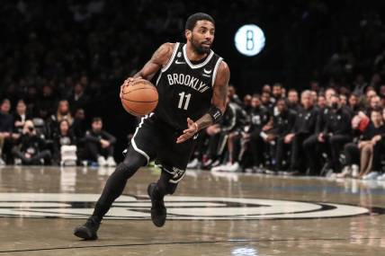 Dec 4, 2022; Brooklyn, New York, USA;  Brooklyn Nets guard Kyrie Irving (11) drives to the basket in the third quarter against the Boston Celtics at Barclays Center. Mandatory Credit: Wendell Cruz-USA TODAY Sports