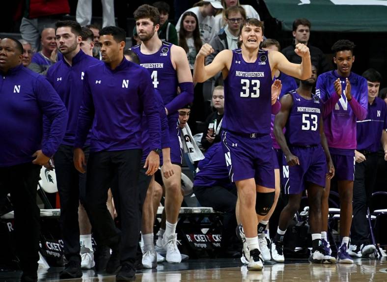 Dec 4, 2022; East Lansing, Michigan, USA; Northwestern Wildcats forward Luke Hunger (33) celebrates their win against the Michigan State Spartans at Jack Breslin Student Events Center. Mandatory Credit: Dale Young-USA TODAY Sports