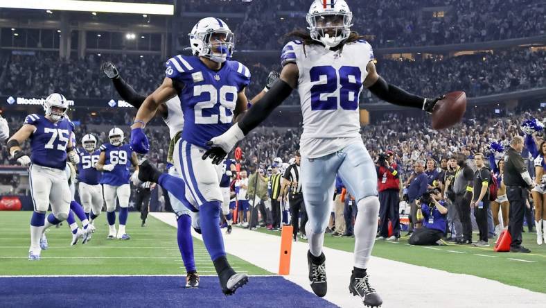 Dec 4, 2022; Arlington, Texas, USA;  Dallas Cowboys safety Malik Hooker (28) recovers a fumble and runs it back for a touchdown  during the fourth quarter against the Indianapolis Colts at AT&T Stadium. Mandatory Credit: Kevin Jairaj-USA TODAY Sports