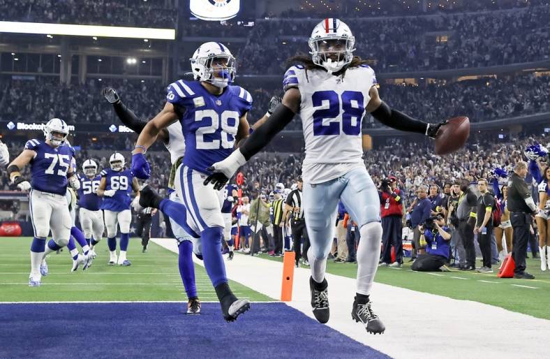 Dec 4, 2022; Arlington, Texas, USA;  Dallas Cowboys safety Malik Hooker (28) recovers a fumble and runs it back for a touchdown  during the fourth quarter against the Indianapolis Colts at AT&T Stadium. Mandatory Credit: Kevin Jairaj-USA TODAY Sports