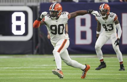 Dec 4, 2022; Houston, Texas, USA; Cleveland Browns defensive end Jadeveon Clowney (90) in action during the game against the Houston Texans at NRG Stadium. Mandatory Credit: Troy Taormina-USA TODAY Sports