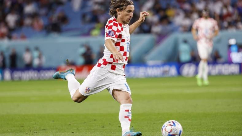 Dec 5, 2022; Al-Wakrah, Qatar; Croatia midfielder Luka Modric (10) controls the ball during the first half of a round of sixteen match against Japan during the 2022 FIFA World Cup at Al-Janoub Stadium. Mandatory Credit: Yukihito Taguchi-USA TODAY Sports