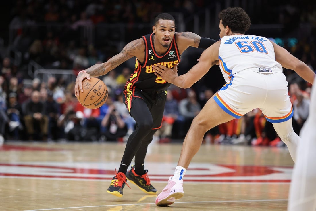 Dec 5, 2022; Atlanta, Georgia, USA; Atlanta Hawks guard Dejounte Murray (5) drives to the basket against the Oklahoma City Thunder in the second quarter at State Farm Arena. Mandatory Credit: Brett Davis-USA TODAY Sports