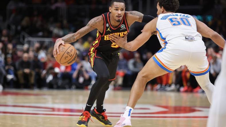 Dec 5, 2022; Atlanta, Georgia, USA; Atlanta Hawks guard Dejounte Murray (5) drives to the basket against the Oklahoma City Thunder in the second quarter at State Farm Arena. Mandatory Credit: Brett Davis-USA TODAY Sports