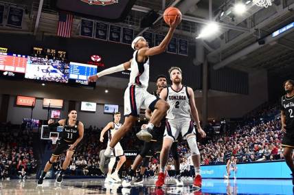 Dec 5, 2022; Spokane, Washington, USA; Gonzaga Bulldogs guard Nolan Hickman (11) shoots the ball against the Kent State Golden Flashes in the first half at McCarthey Athletic Center. Mandatory Credit: James Snook-USA TODAY Sports